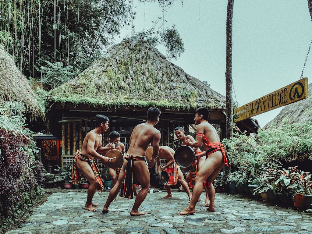 A group of men performing a traditional cultural dance in Baguio's Talipanan Village.