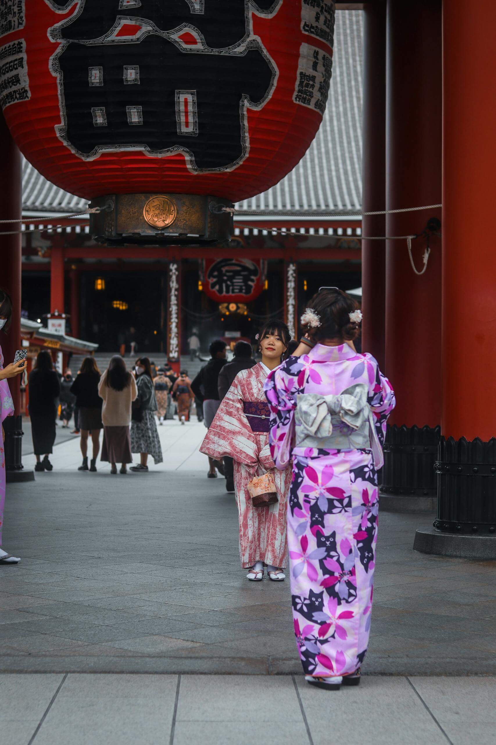 Tourists in traditional kimono at Senso-ji Temple in Tokyo, capturing the essence of Japanese culture.