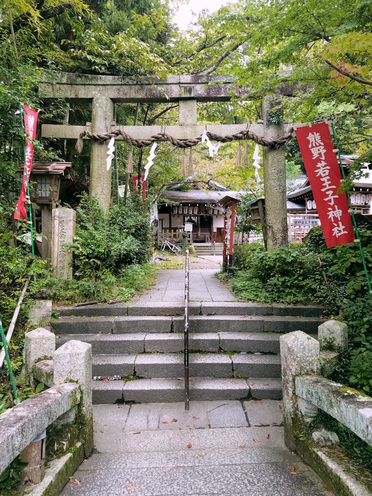 A serene view of the Kumano Nyakuoji Shrine entrance with a traditional torii gate in Kyoto, Komano Kodo Japan tour