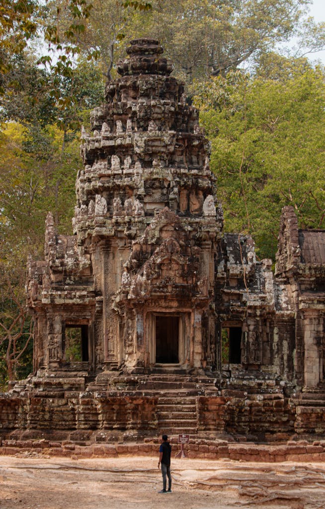 A stunning view of an ancient Hindu temple in Siem Reap, Cambodia, surrounded by lush greenery. Siem Reap Cambodia tour