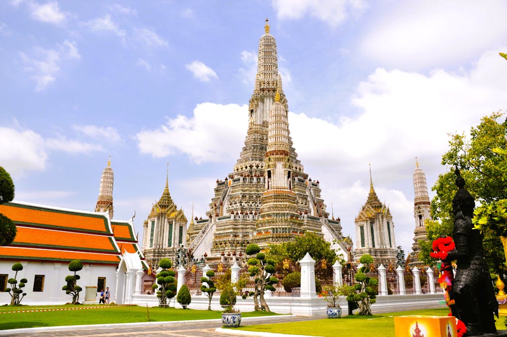 Beautiful architectural view of Wat Arun temple against blue sky in Bangkok, Thailand trip.
