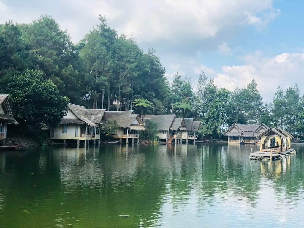 Charming wooden houses by a serene lake in Samarang, West Java, Indonesia. Ideal for leisure and travel. Indonesia trip