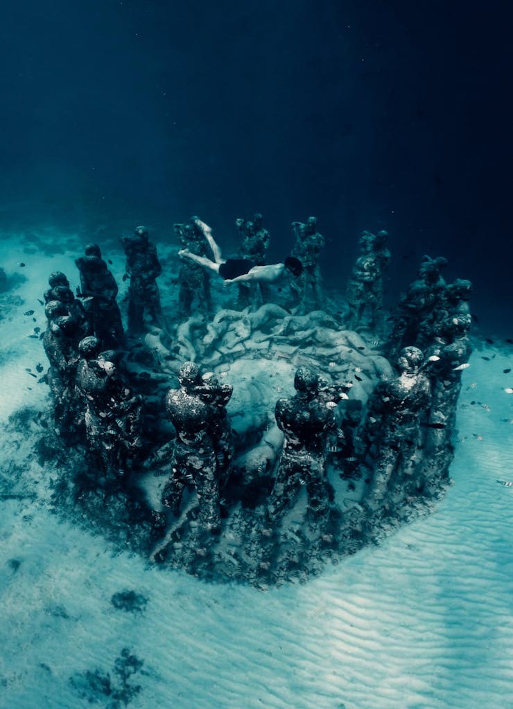 Diver exploring the underwater sculpture circle in Gili Meno, Gili Islands Indonesia tour