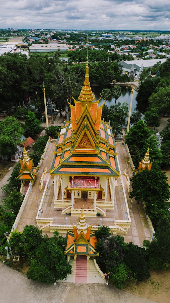 Stunning aerial view of a traditional Cambodian temple surrounded by lush greenery in Phnom Penh Cambodia tour