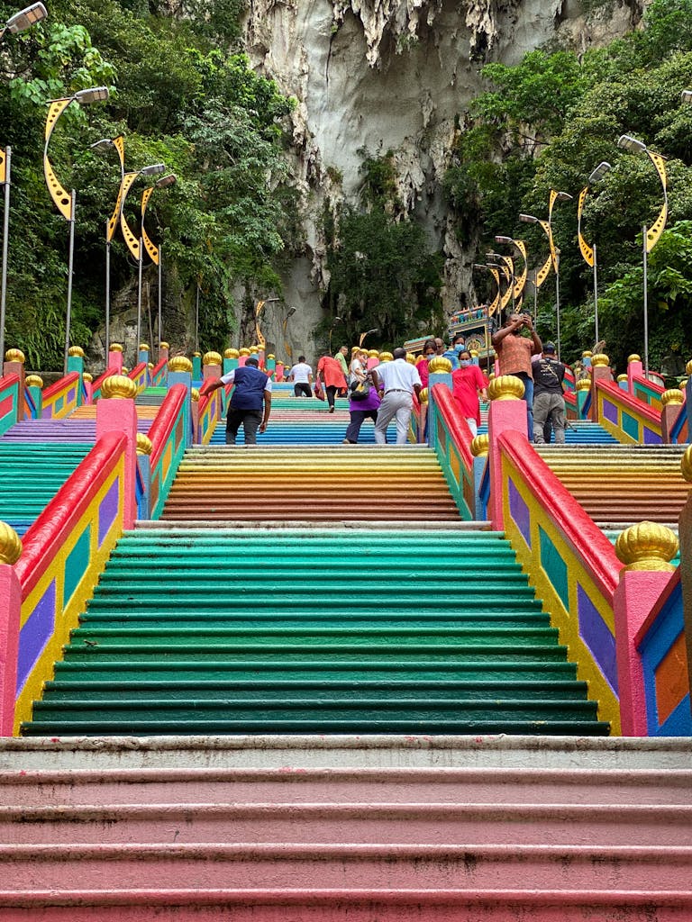 Vibrant steps climbing towards the Batu Caves, a popular Malaysian trip tourist spot.