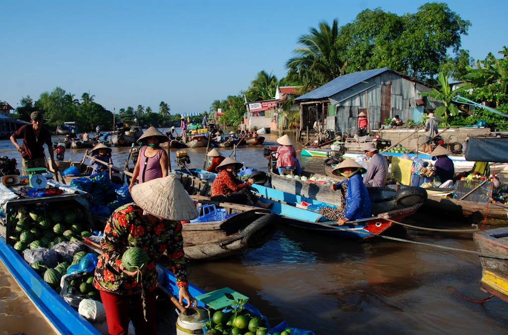 A vibrant scene at a floating market in Ho Chi Minh City, Vietnam, showcasing local culture and commerce.