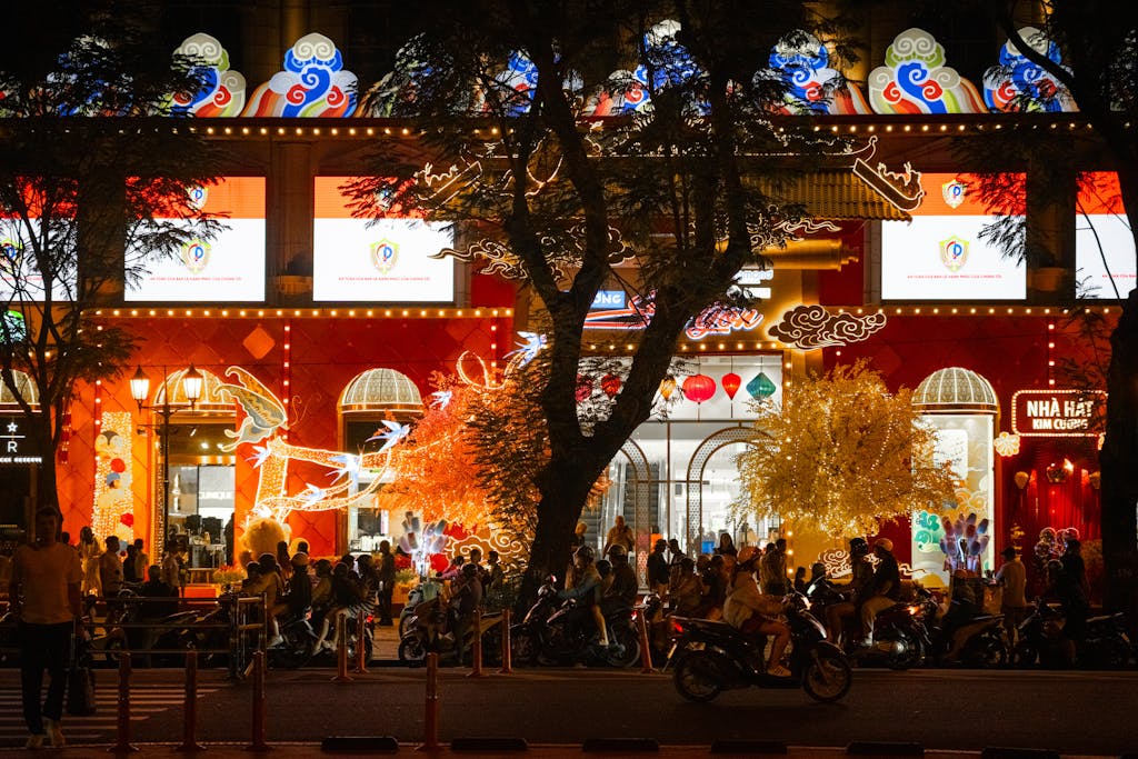 Bustling Ho Chi Minh City nightlife captured in a colorful street scene with neon lights and crowds.