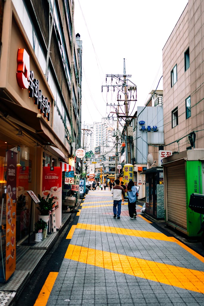 Candid street view capturing the lively essence of a Seoul alleyway.