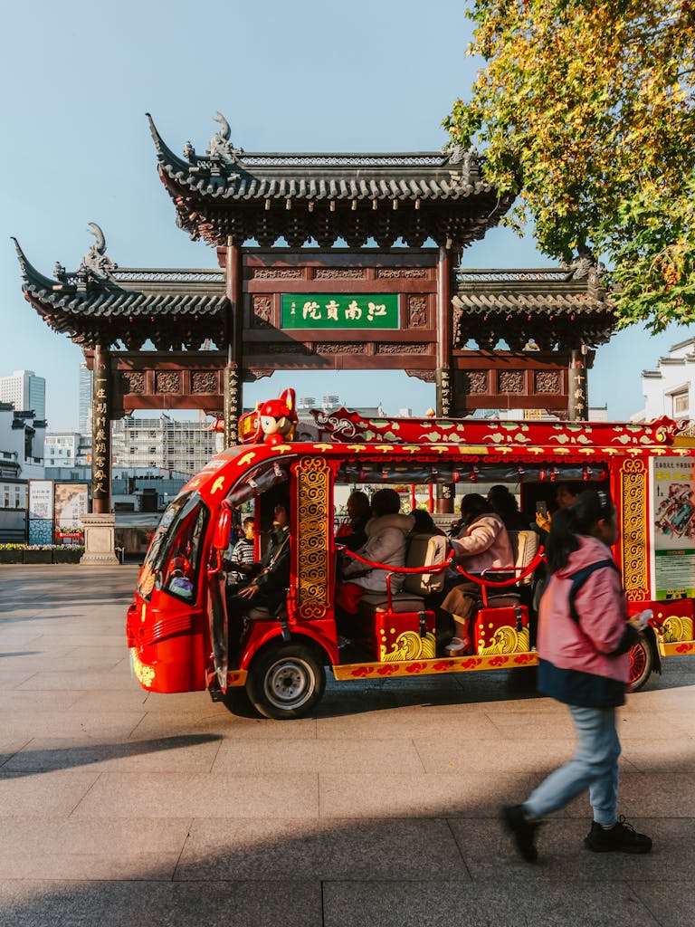 Colorful local transport at the historic Nanjing Confucius Temple, capturing daily urban life. Beijing China tour