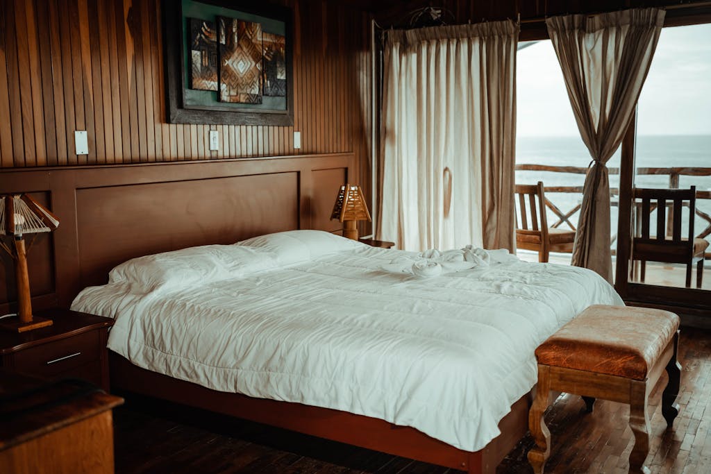 Elegant hotel room with a cozy bed and ocean view. Perfect for relaxation.