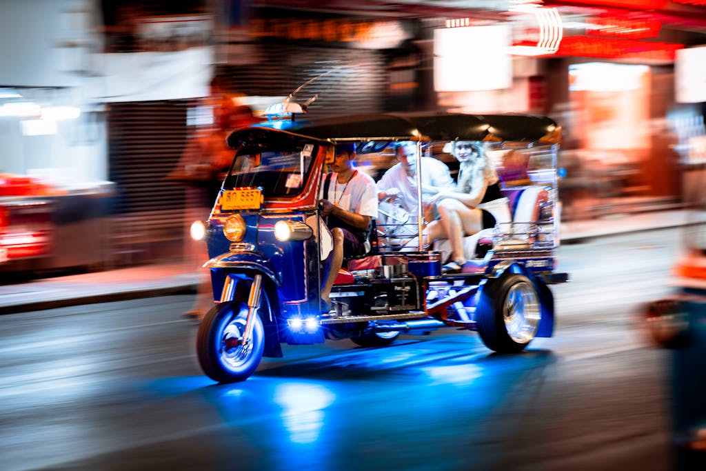 Experience the vibrant nightlife of Bangkok with a tuk-tuk ride through the bustling streets.
