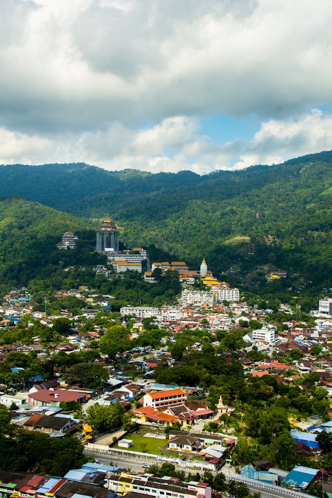 High-angle view of Air Itam, Penang, showcasing lush hills and the iconic Kek Lok Si Temple. Penang Malaysia tour